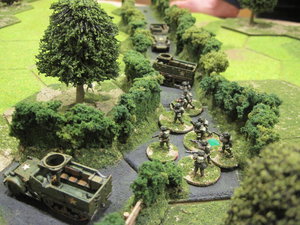 British infantry prepare to leave the bockage lane to assault the anti-tank gun position